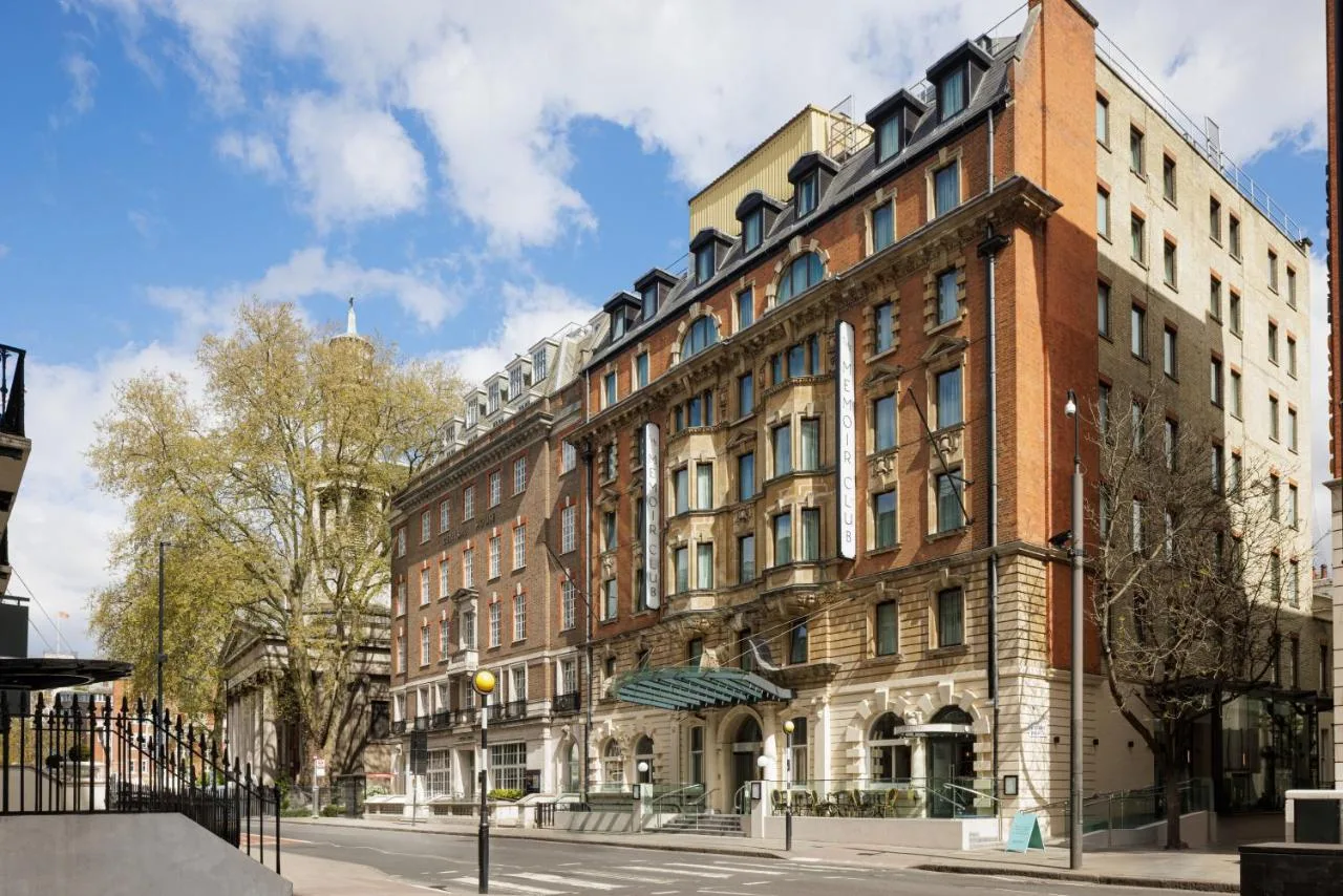 a large brick building on a city street at The Memoir Club in London
